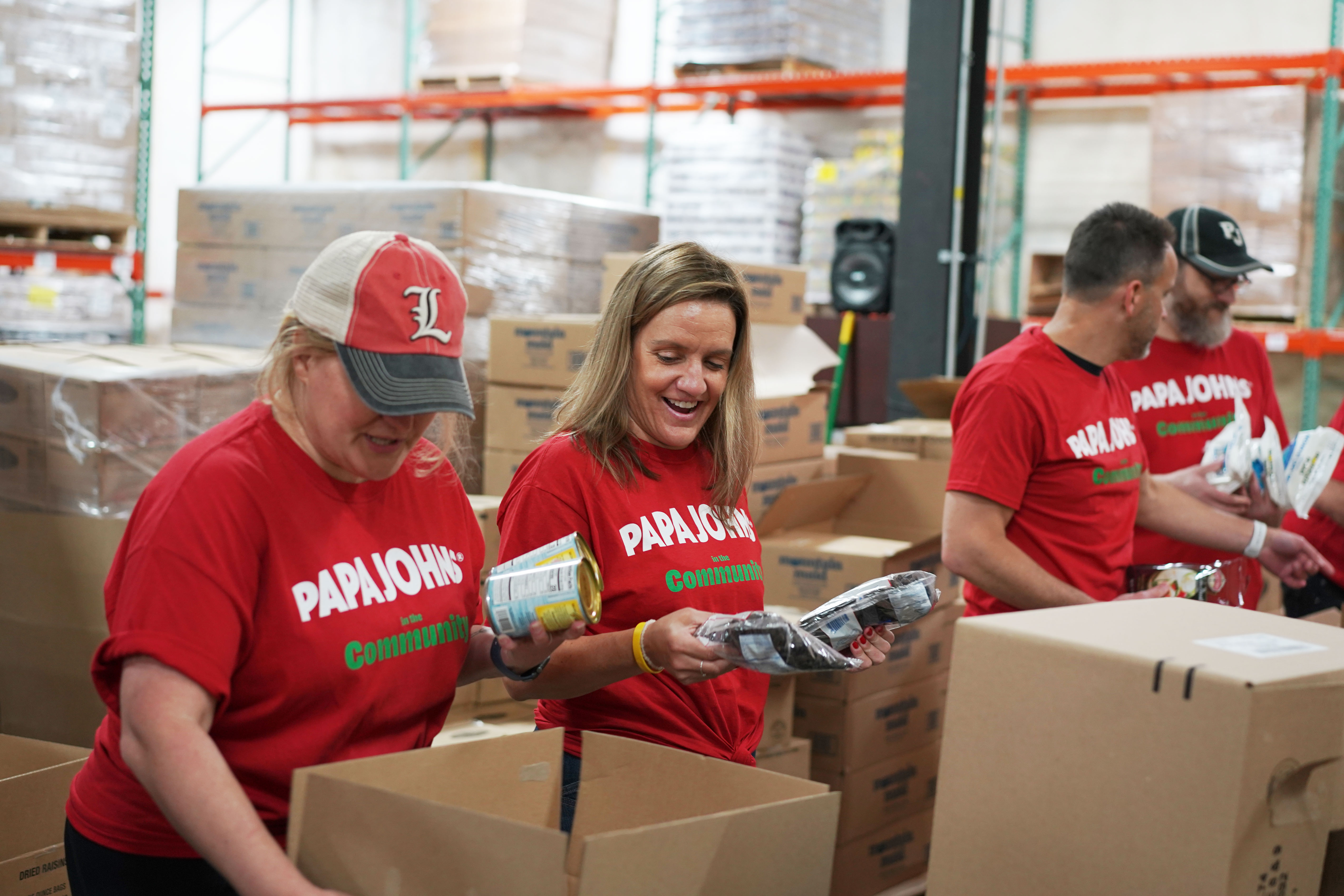 Papa Johns team members volunteer at food bank