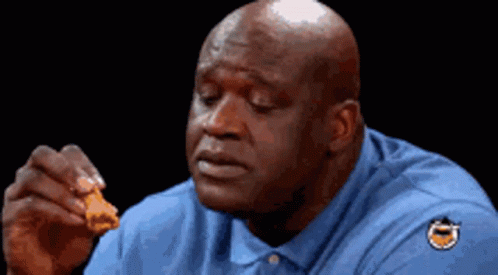 Shaq eating chicken wing