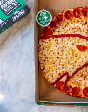 Hawks logo on Papa Johns pizza
