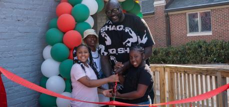 Shaq and local youths cut the ribbon at new Papa Johns restaurant